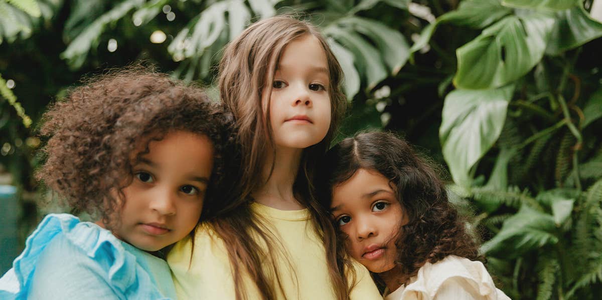 three little girls in dresses