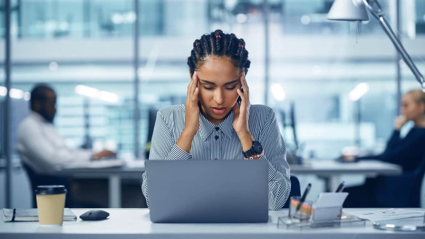 Study Shows 77% Of Workers Have Been Impacted By Quiet Cutting stressed woman at work