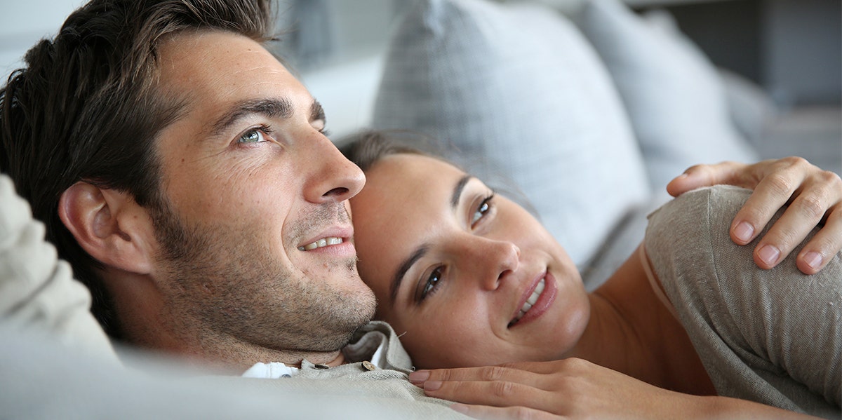 wife and husband in bed together