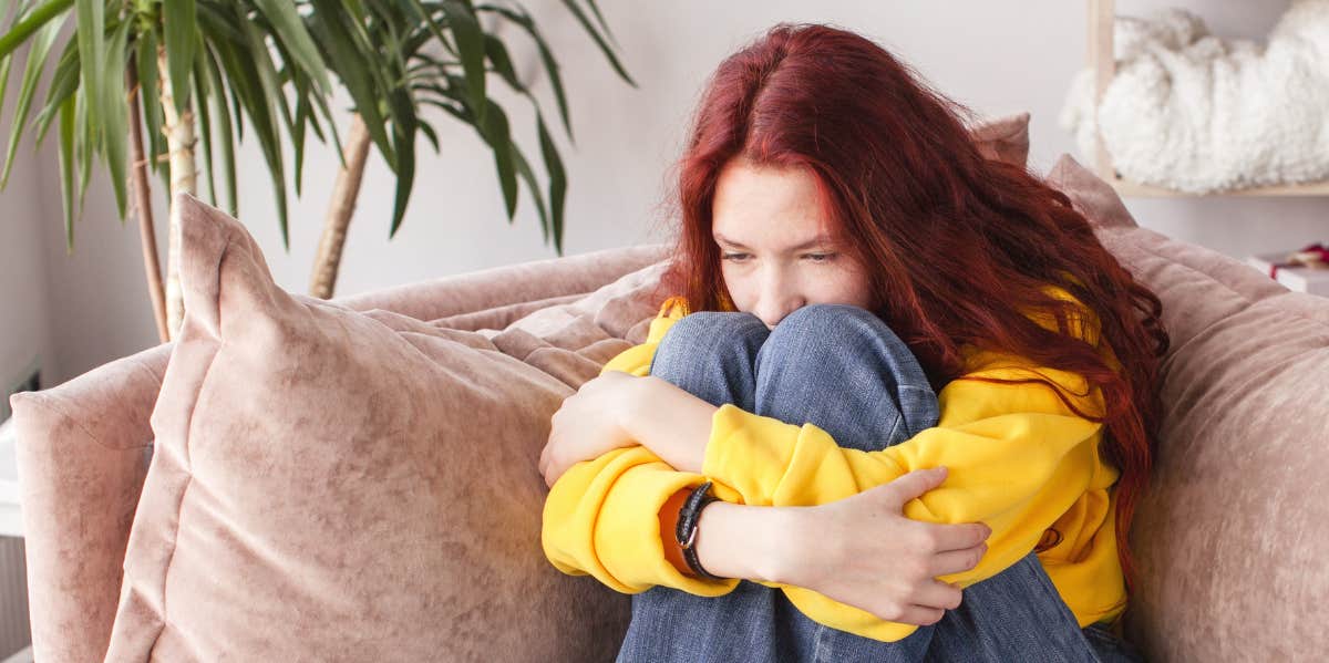 sad girl on couch