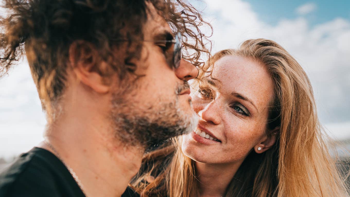 6 Things That Make You Feel Deeply Loved But Are Actually Red Flags woman smiling at man