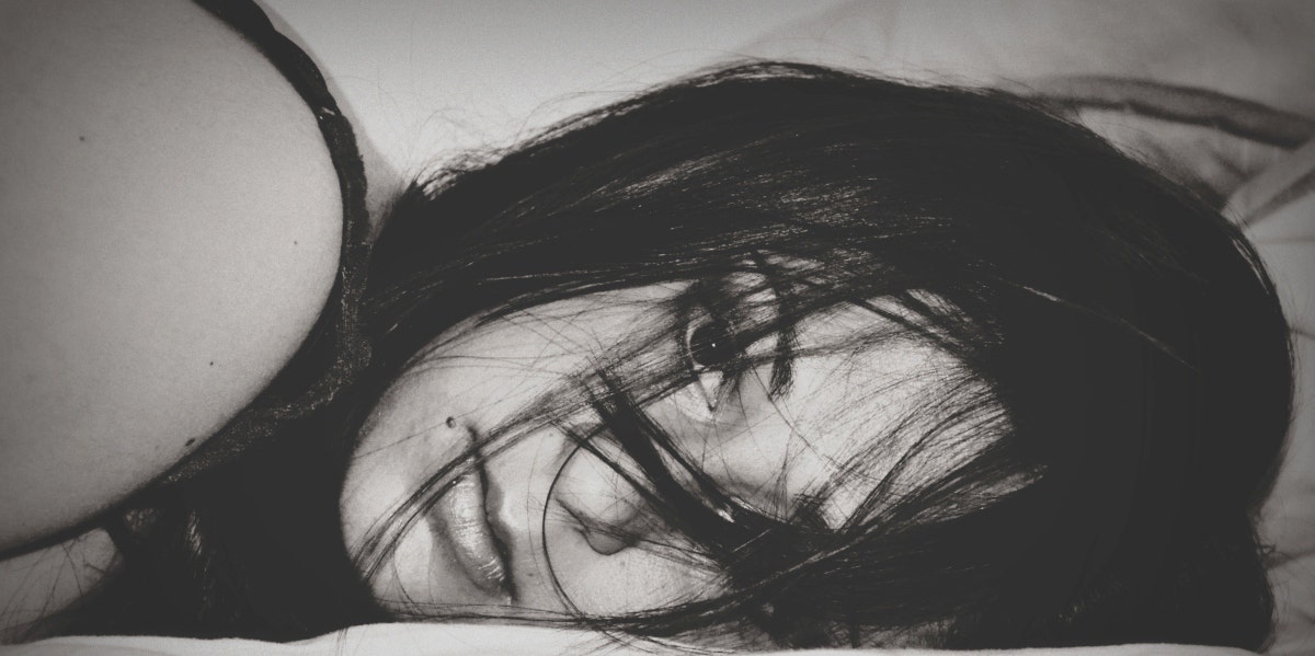 suicide aftermath black and white photo of woman lying down