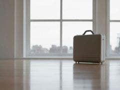 suitcase in an empty room