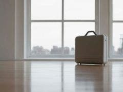 Moving For Love? Some Questions To Consider First suitcase in an empty room