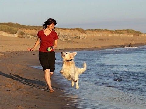 woman running with a dog