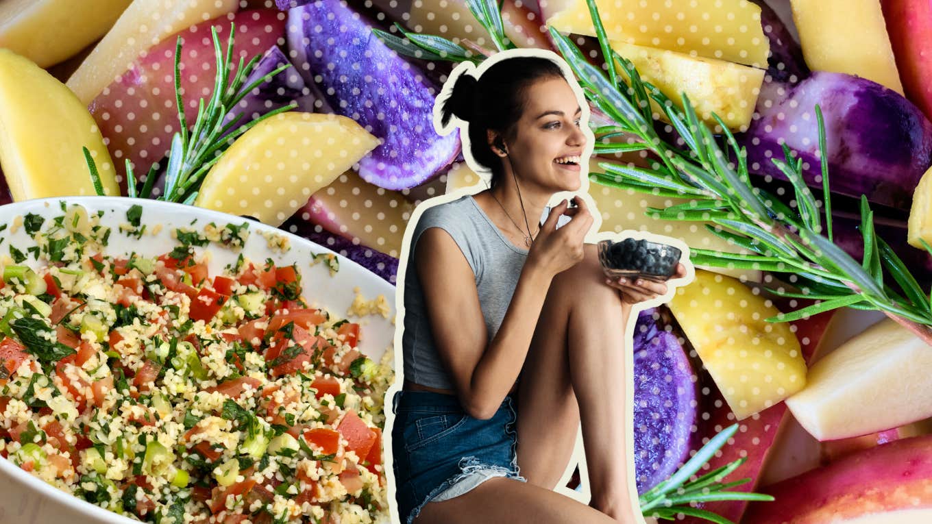 Woman surrounded by superfoods eating blueberries