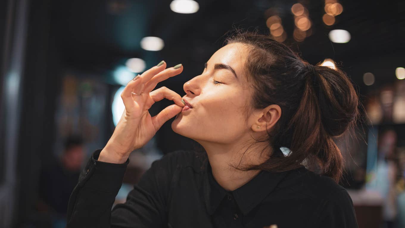 Closeup of woman eating in a cafe
