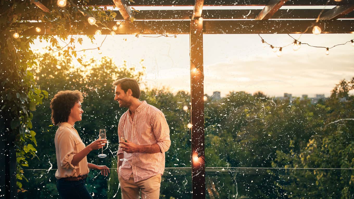 Couple on a date at sunset by the water