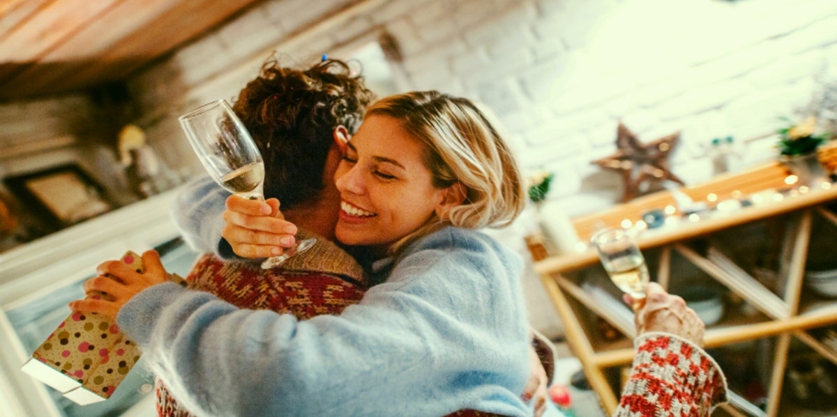 man and woman toasting at holidays