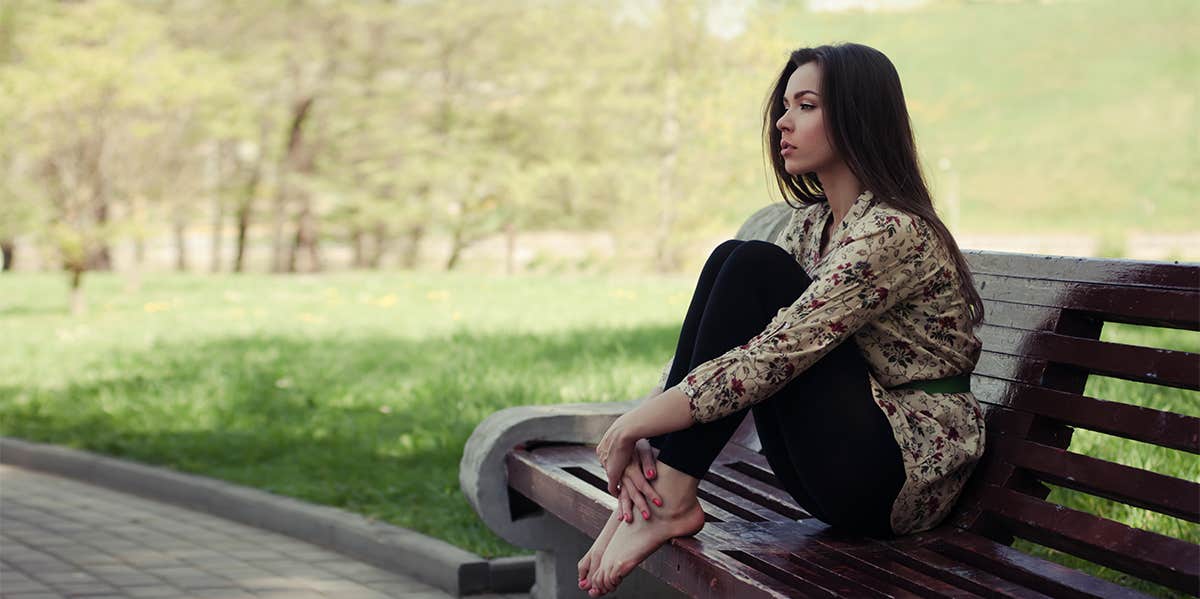 woman sitting on bench