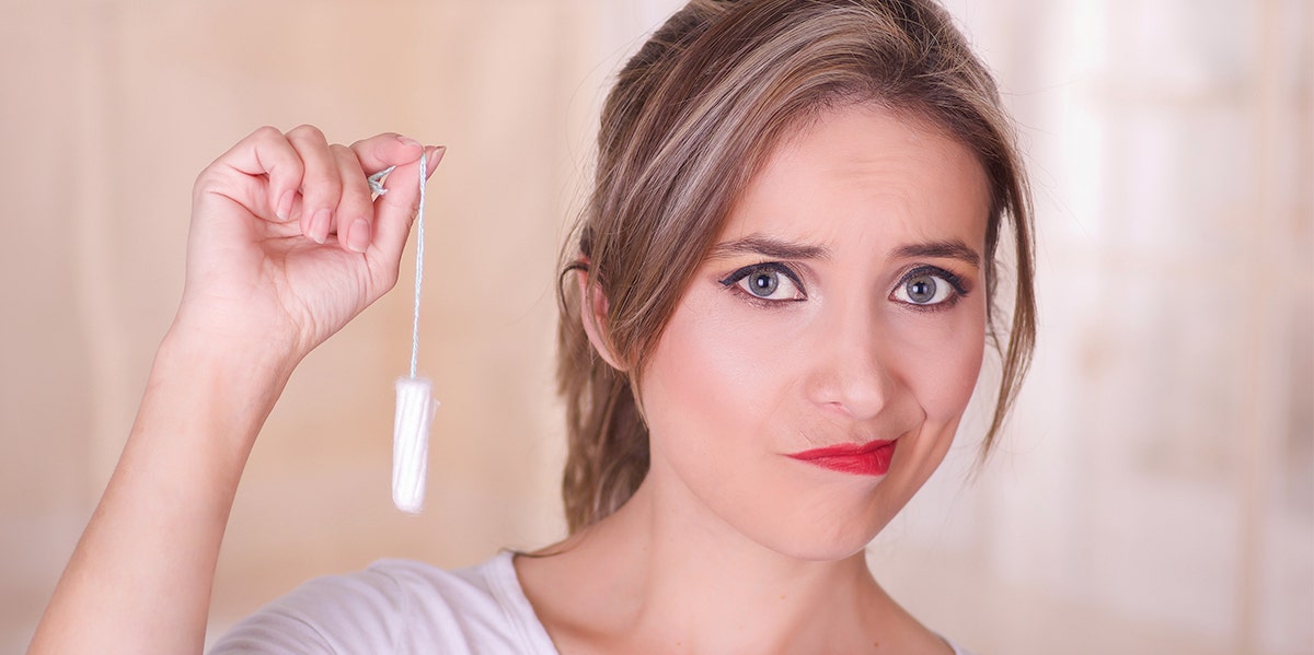 woman holding tampon