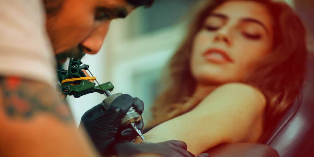 woman getting a tattoo