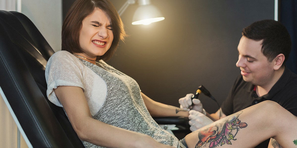 Meet The Woman Who Tattooed Her Eyeballs Black photo of woman getting a tattoo