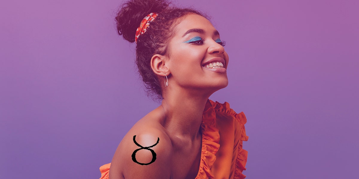 Taurus Woman: Love, Personality Traits And Facts woman wearing blue eyeshadow with taurus tattoo on shoulder
