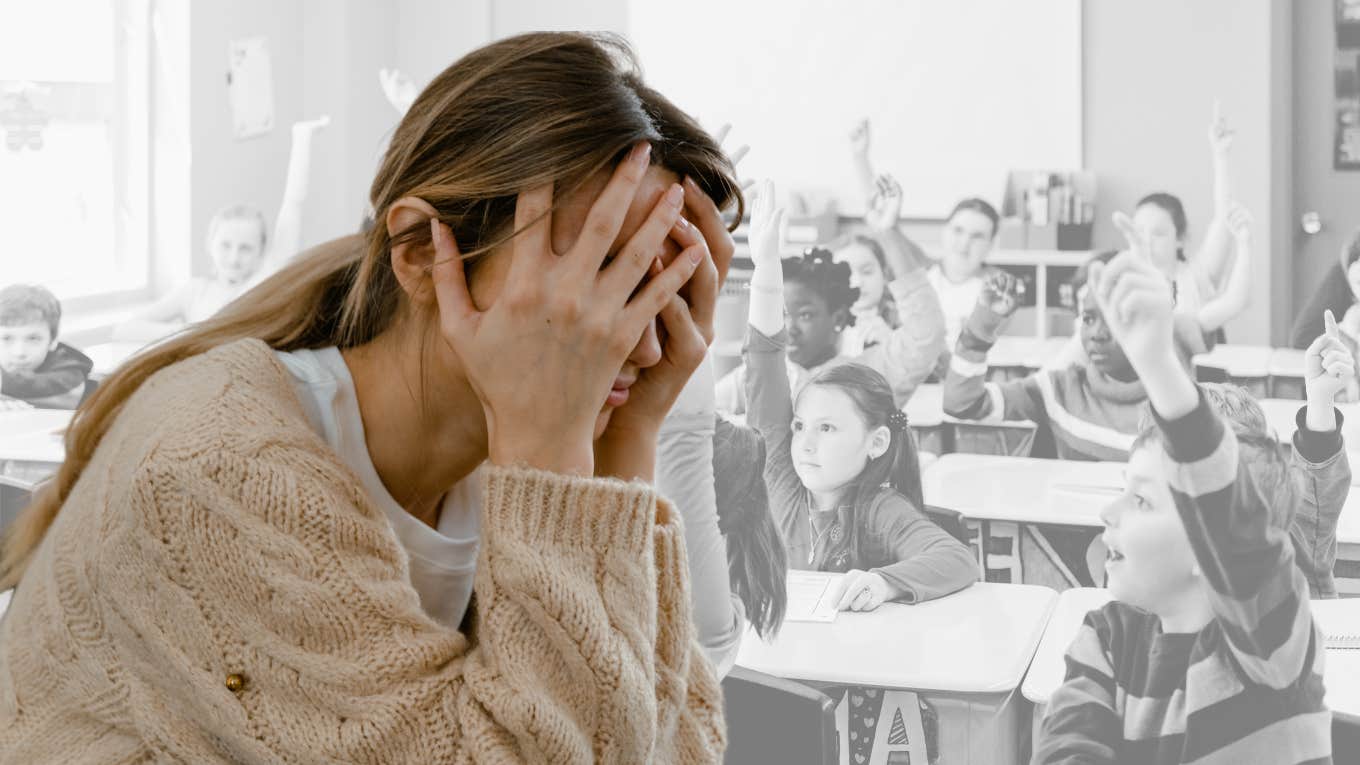 Teacher looking overwhelmed in her classroom. 