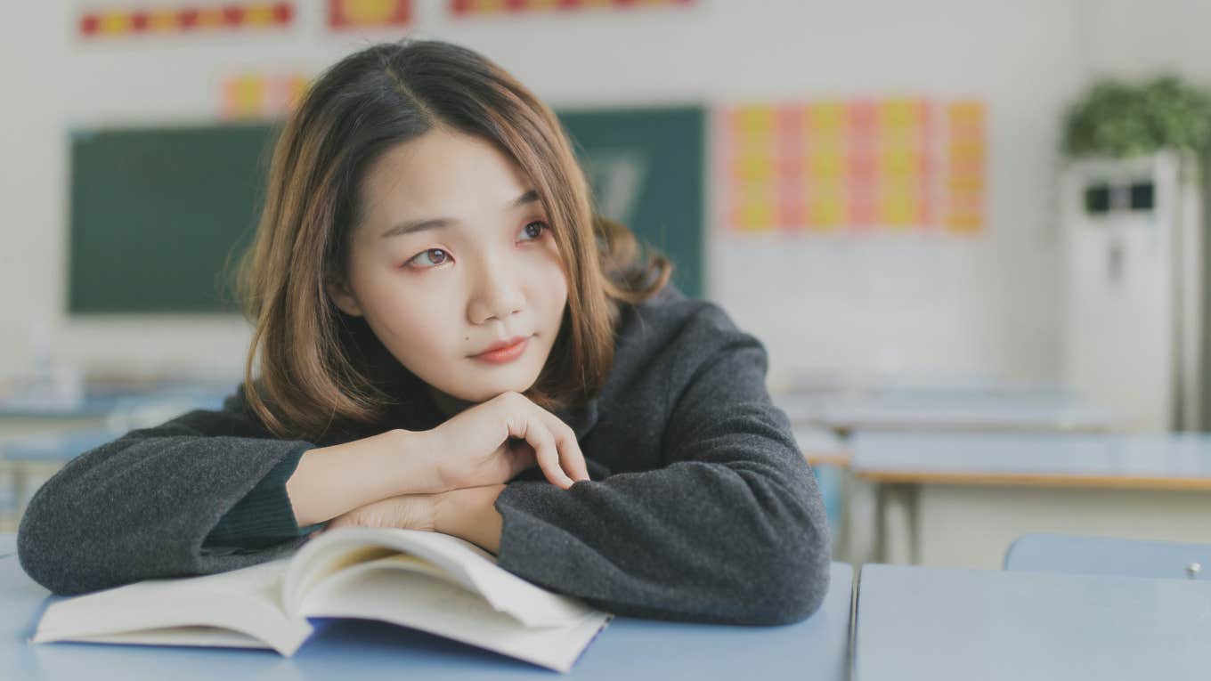 girl reading at desk 