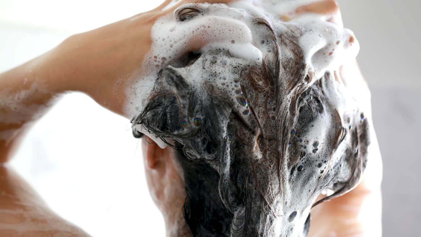 woman shampooing her hair