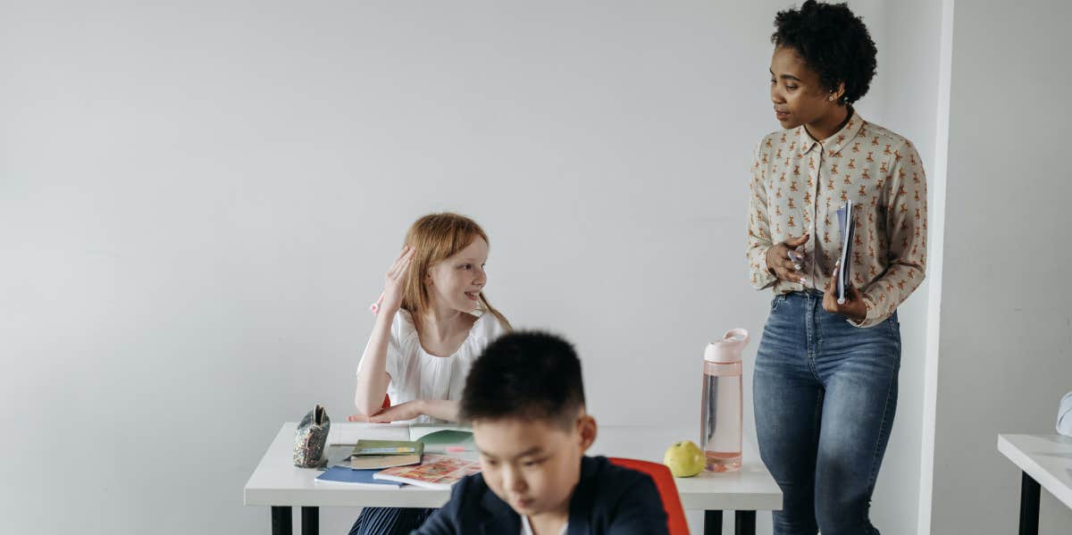 Teacher talking to students