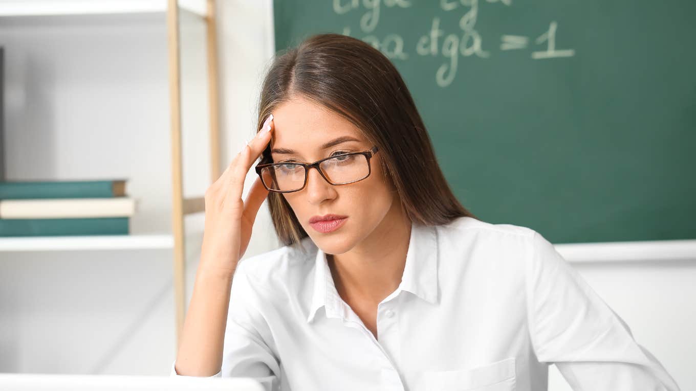 stressed teacher wearing glasses