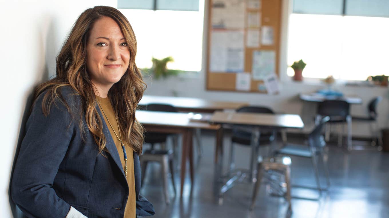 teacher standing outside classroom 