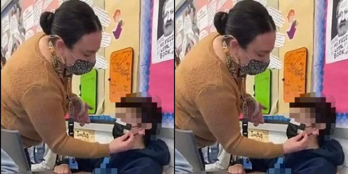teacher taping mask to male students mouth