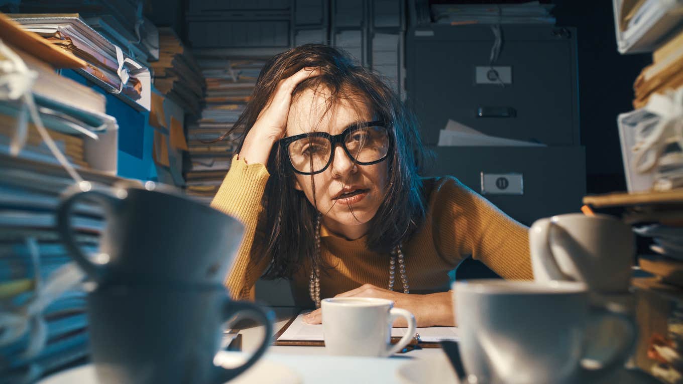 Tech Worker Asked For A Mental Health Day And Received An Email From Boss About The Example She Was Setting Stressed and exhausted woman sitting at office desk and working overtime
