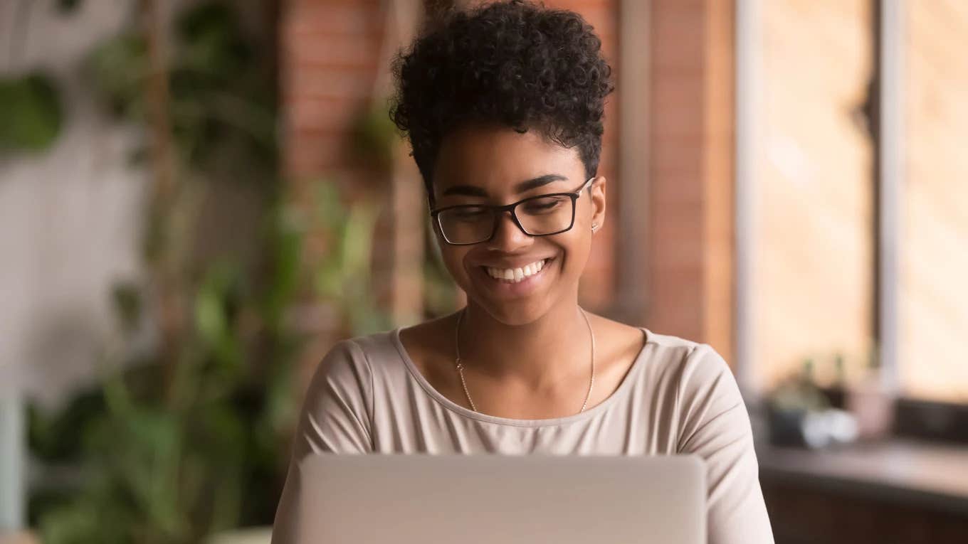 young black woman typing on computer