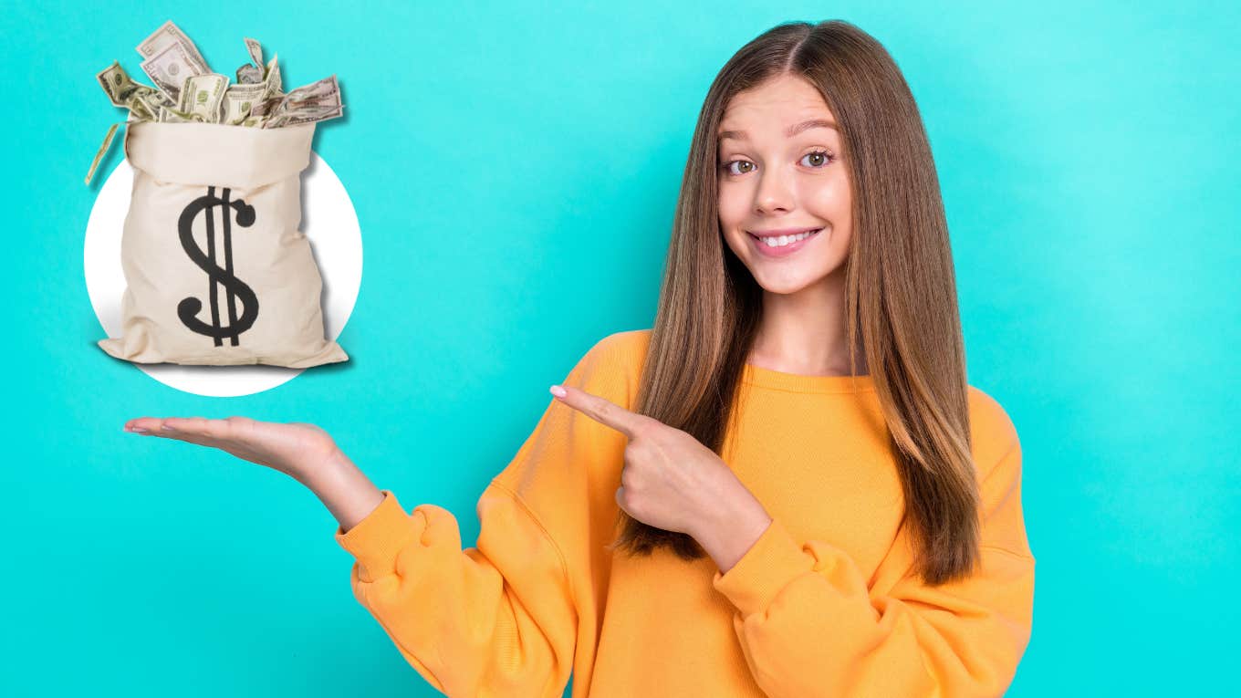 teen girl pointing at bag of money