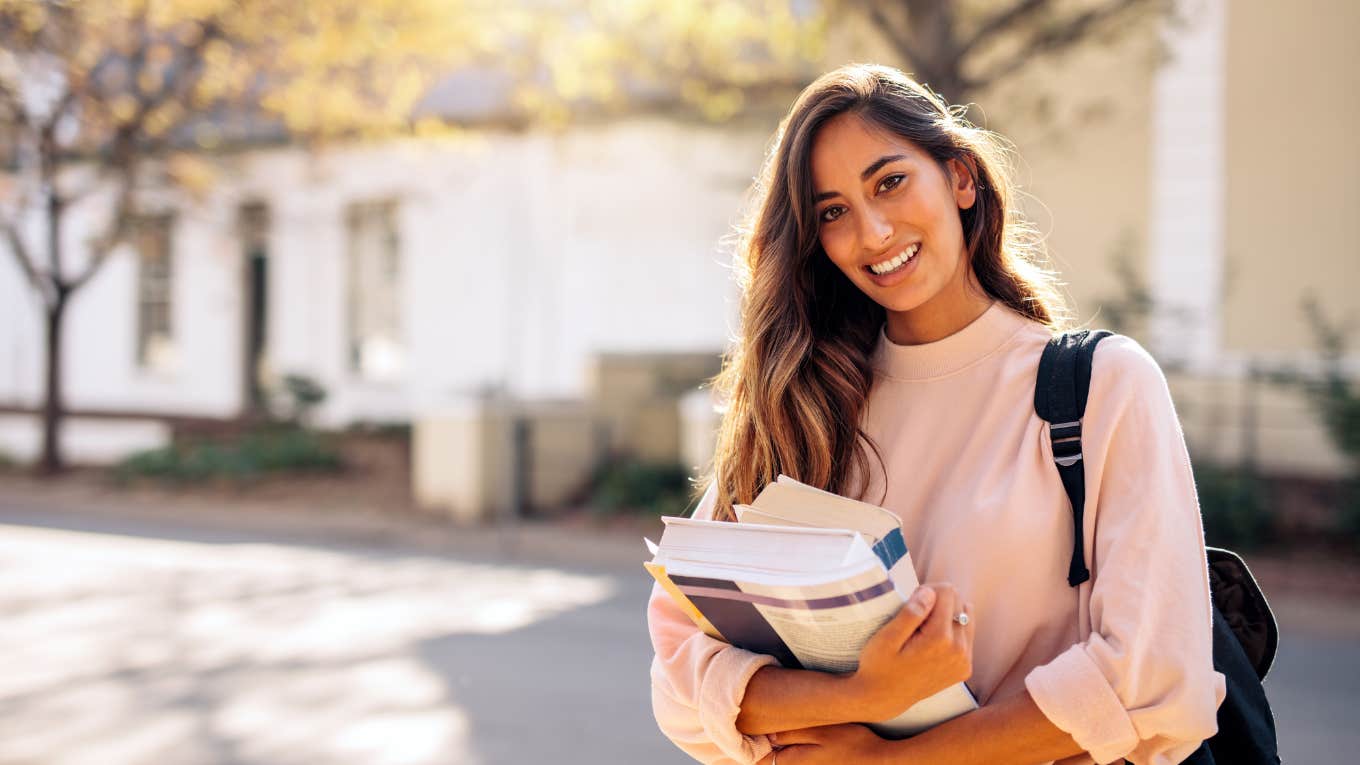 college girl holding books