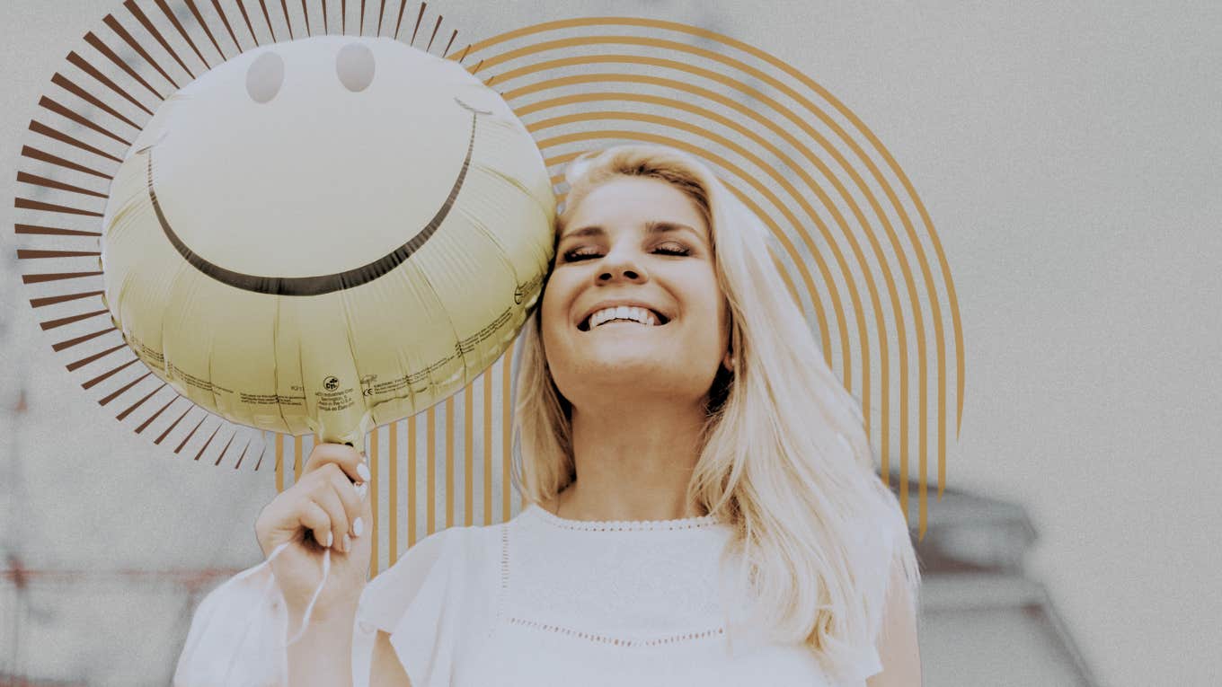 Woman smiling with a balloon 