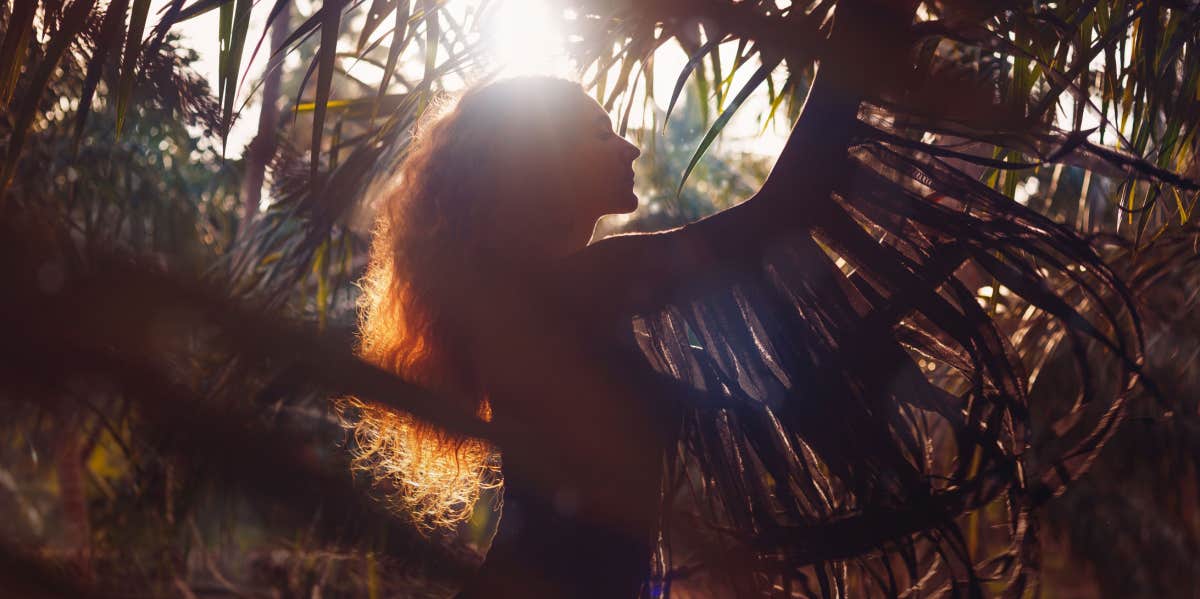 10 Signs You Move Through Life Just Like a High Vibrational Psychic spiritual woman with sun shining down