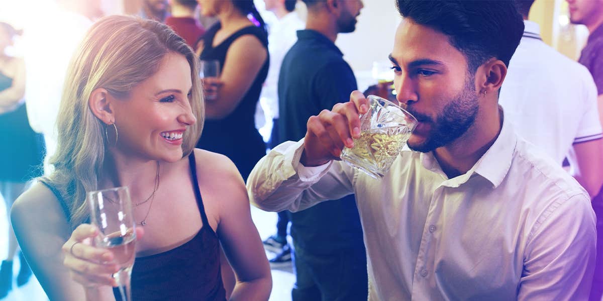 guy and girl at bar drinking