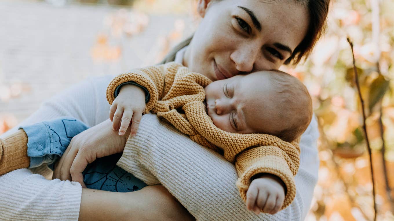 mom holding newborn baby