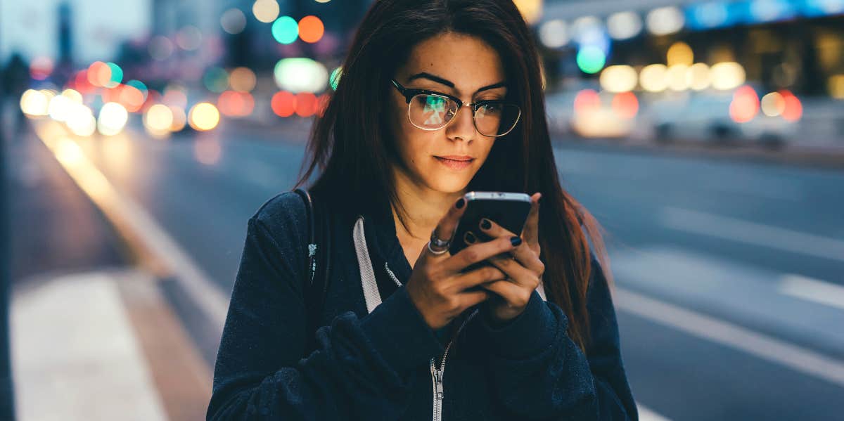 woman looking at her phone