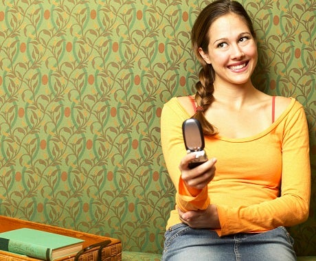 woman with cell phone Is This Normal? He Won't Stop Texting