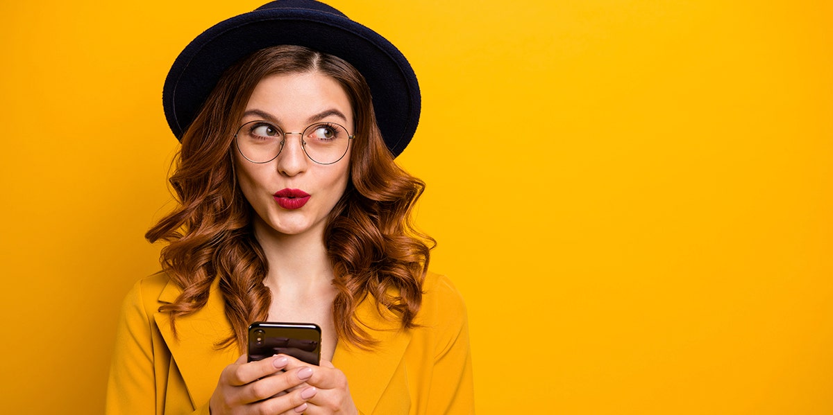 Woman Responds To Being Dumped By Text In The Best Way Possible woman in black against orange background