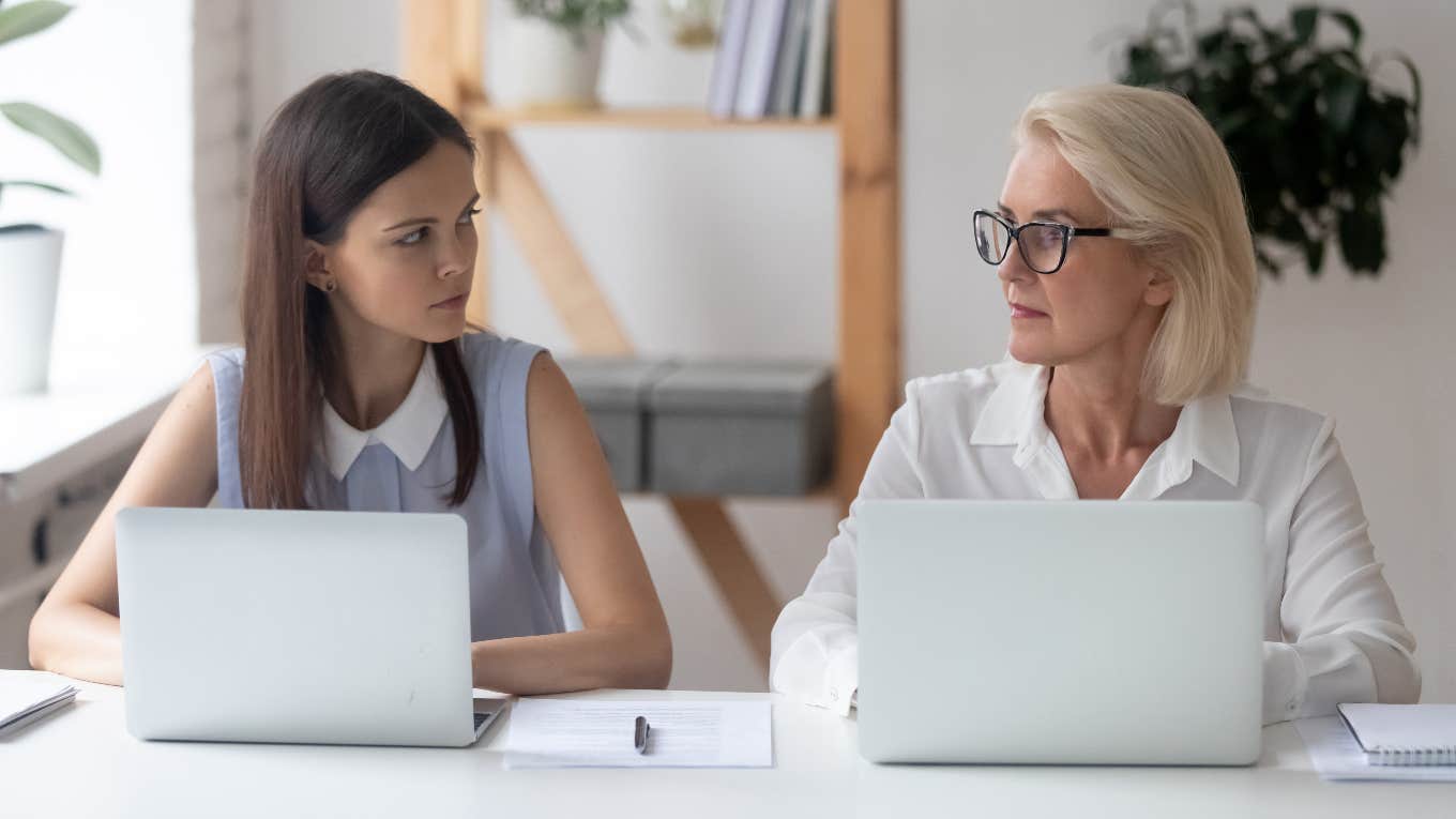 Two employees sitting at computers