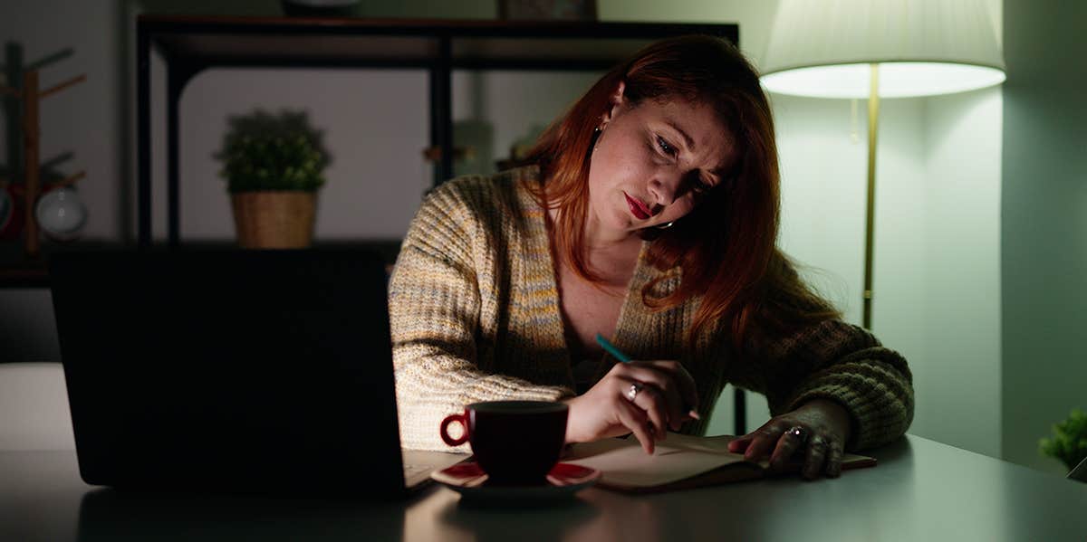 The Cruel Irony Of Being A Humor Writer With Crippling Depression woman writing at night