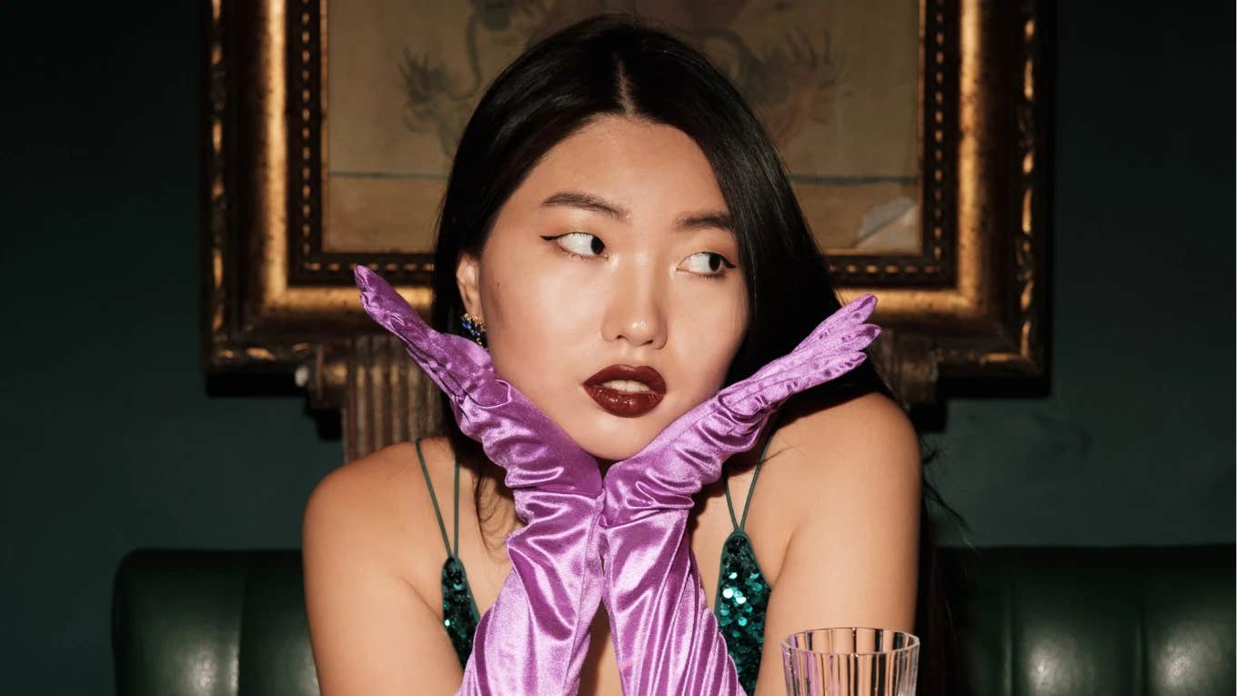 The 5 Ways A Woman Protects Her Energy When She Goes Out — And How It Makes Her More Attractive beautiful woman wearing purple satin gloves to protect her energy on night out