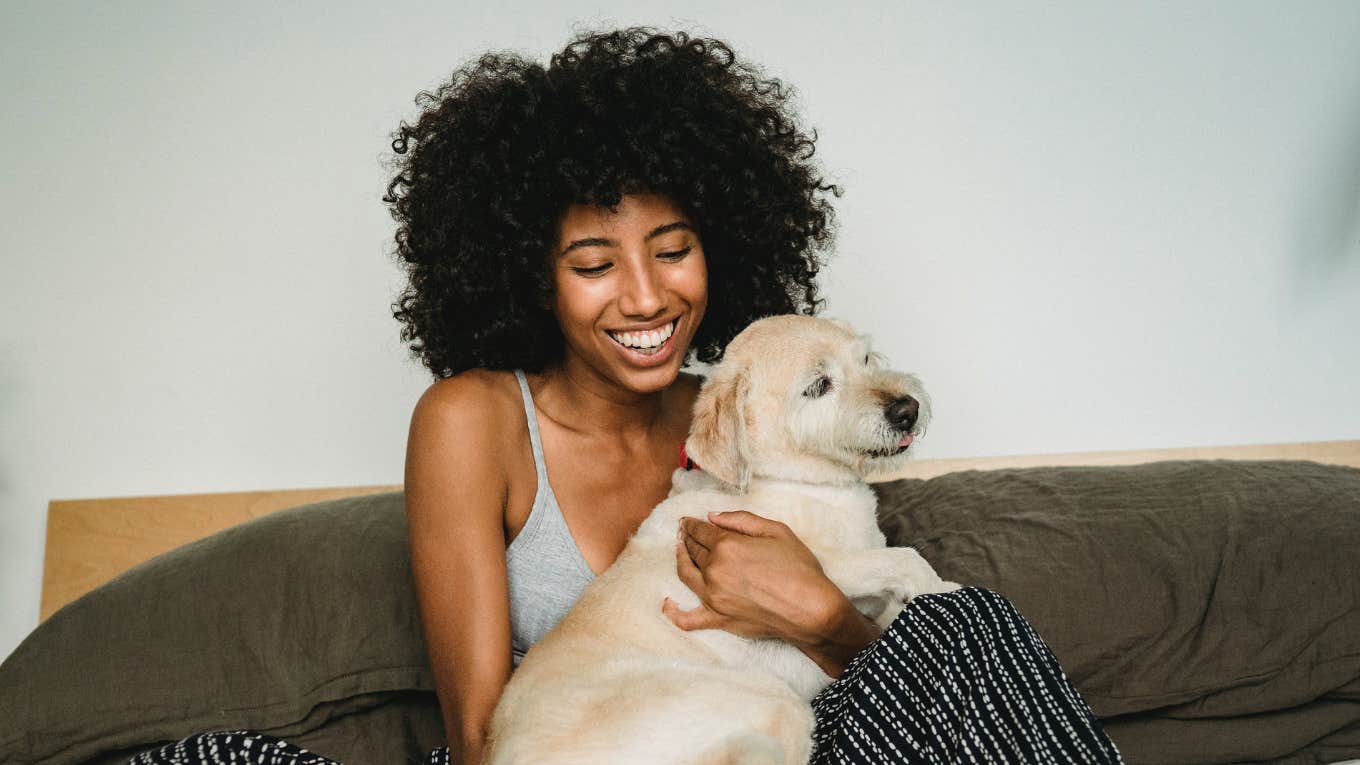 woman petting a dog