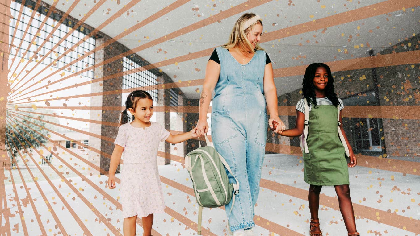 Mother walking her children into school