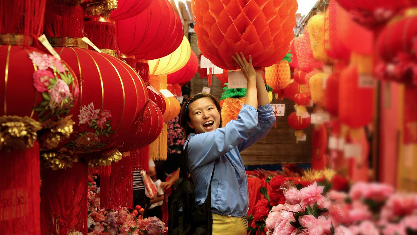 smiling woman with chinese new year decorations