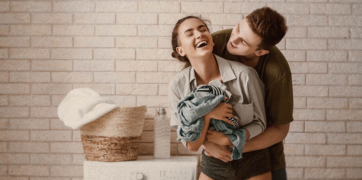 couple hugging when washing cloth