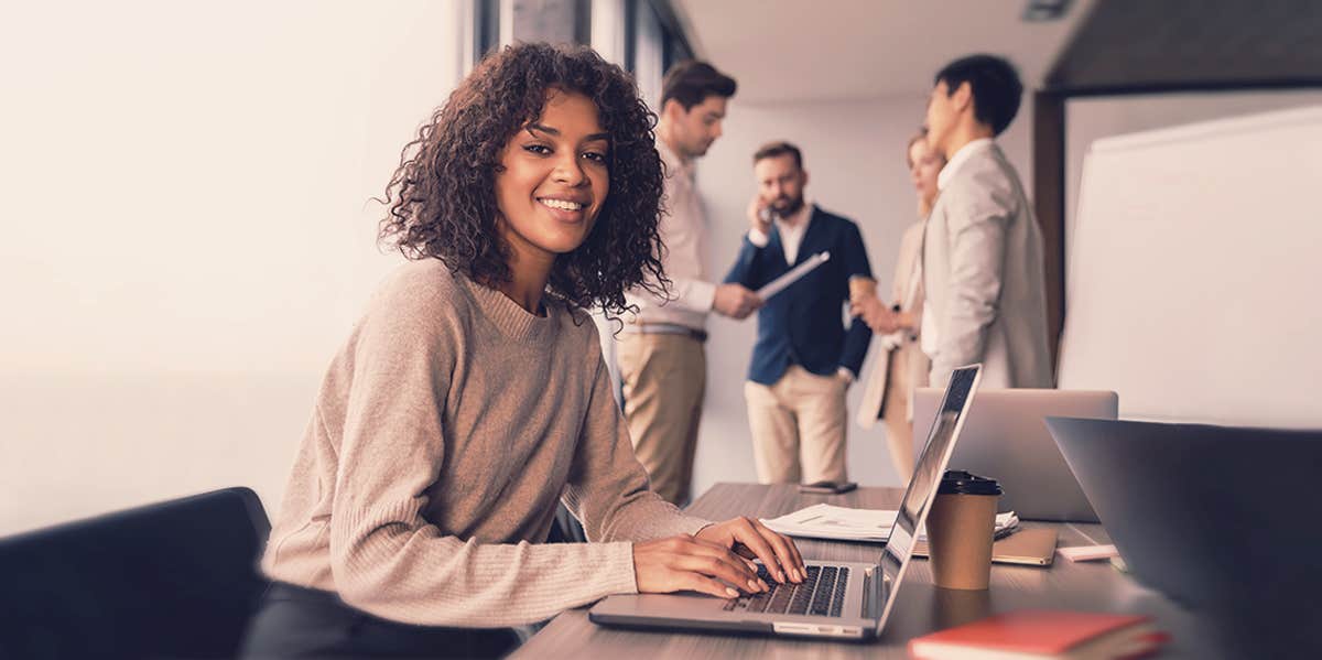 smiling woman on laptop