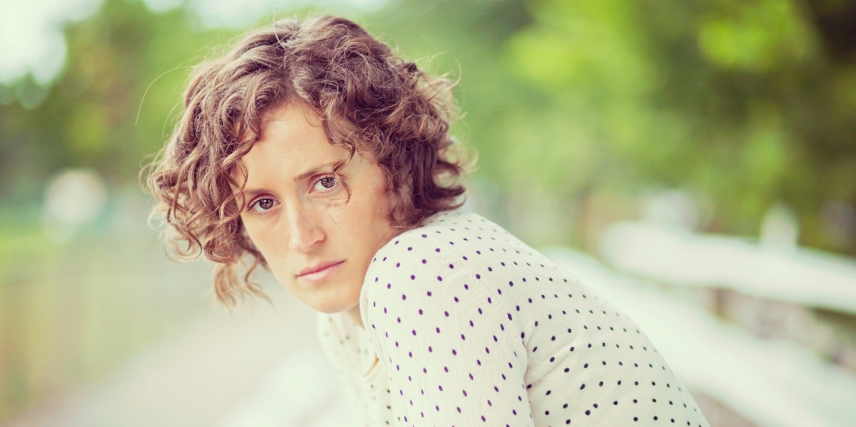 the truth about my divorce woman looking at the camera
