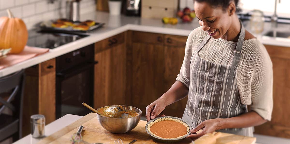 The Yummy-But-Weird Scent That Drives Guys Wild woman making pumpkin pie