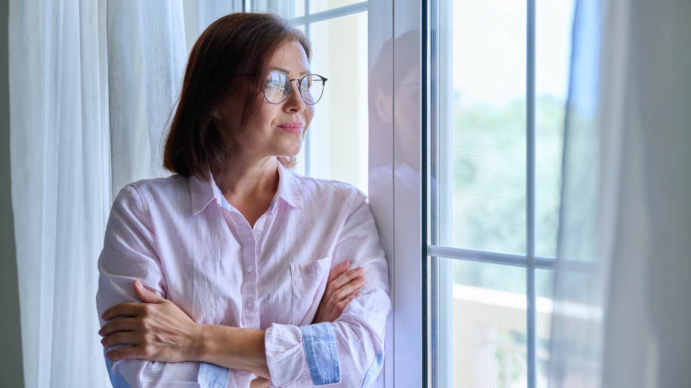 woman looking out the window