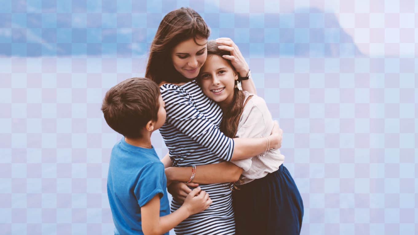 Values A Therapist Hopes Her Kids Gain From Attachment Based Parenting a mom embracing her young kids