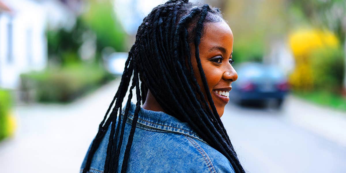 smiling woman in jean jacket