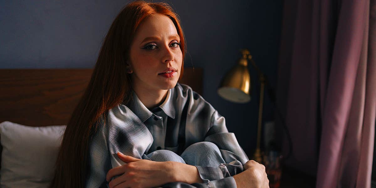 If You Keep Doing These 13 Things, You'll Be Eternally Unhappy sad girl sitting on bed alone